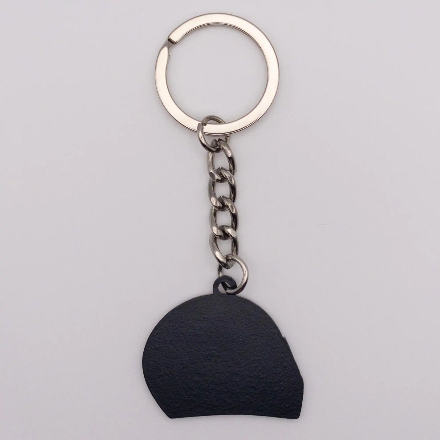 Back of Charles Leclerc 2022 Helmet Enamel Keychain on white background