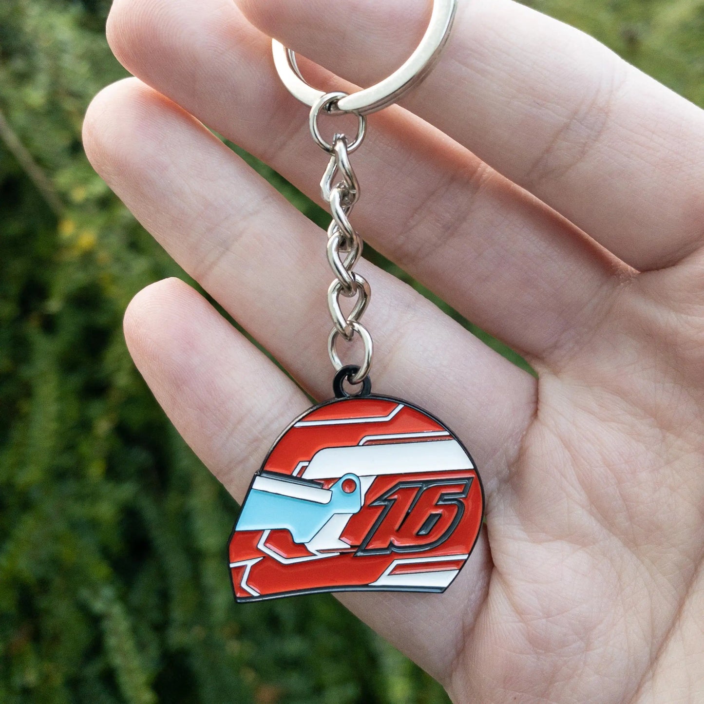 Charles Leclerc 2022 Helmet Enamel Keychain shown in hand