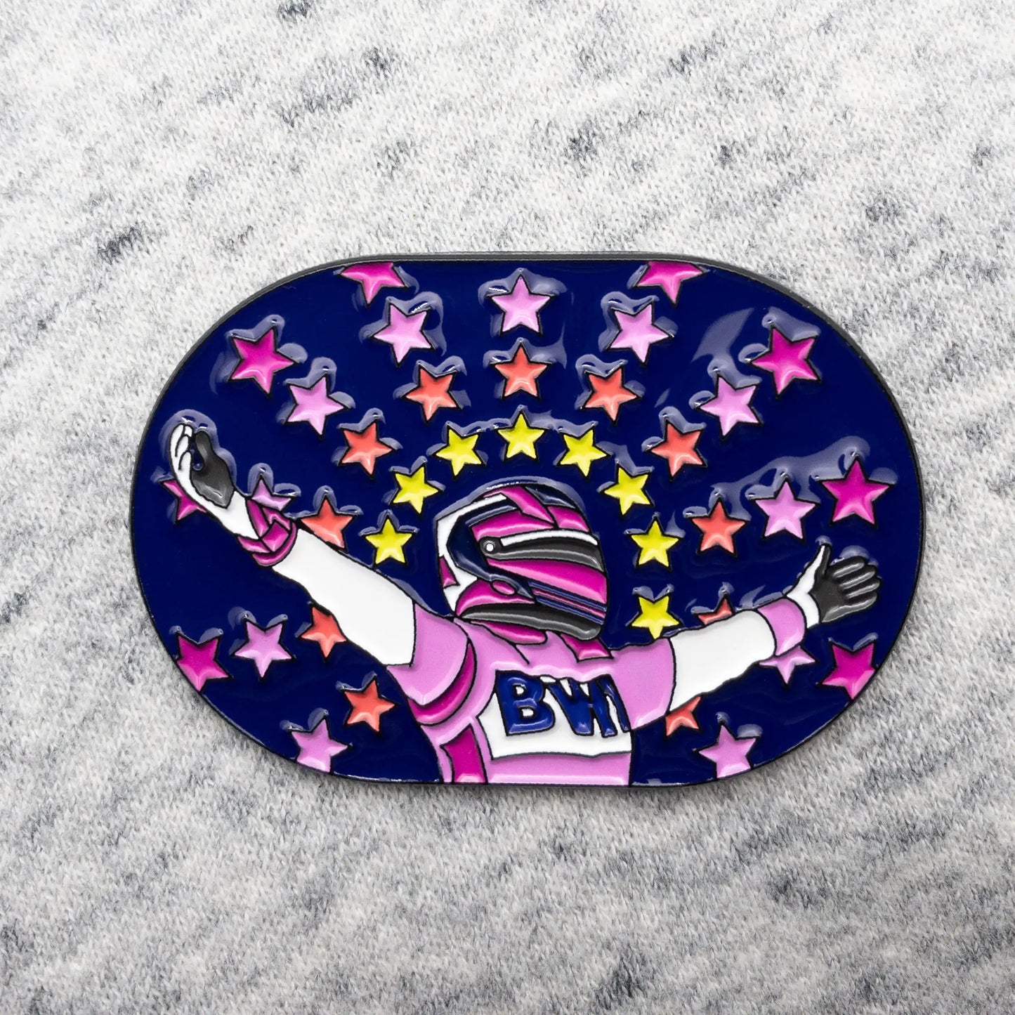 Sergio Perez "Vicotry at Bahrain" Enamel Pin shown on grey fabric