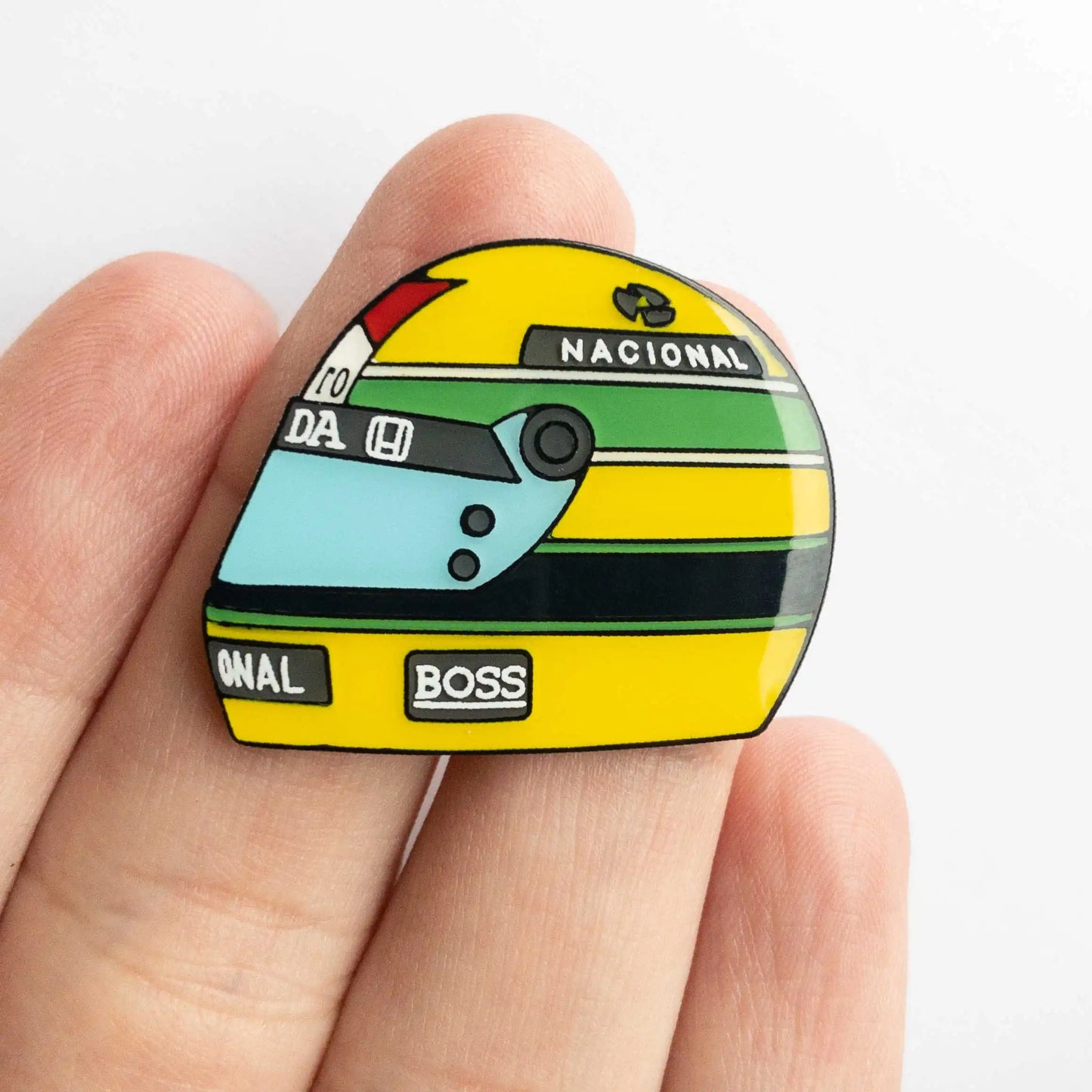 Ayrton Senna 1988 Helmet Enamel Pin shown on hand