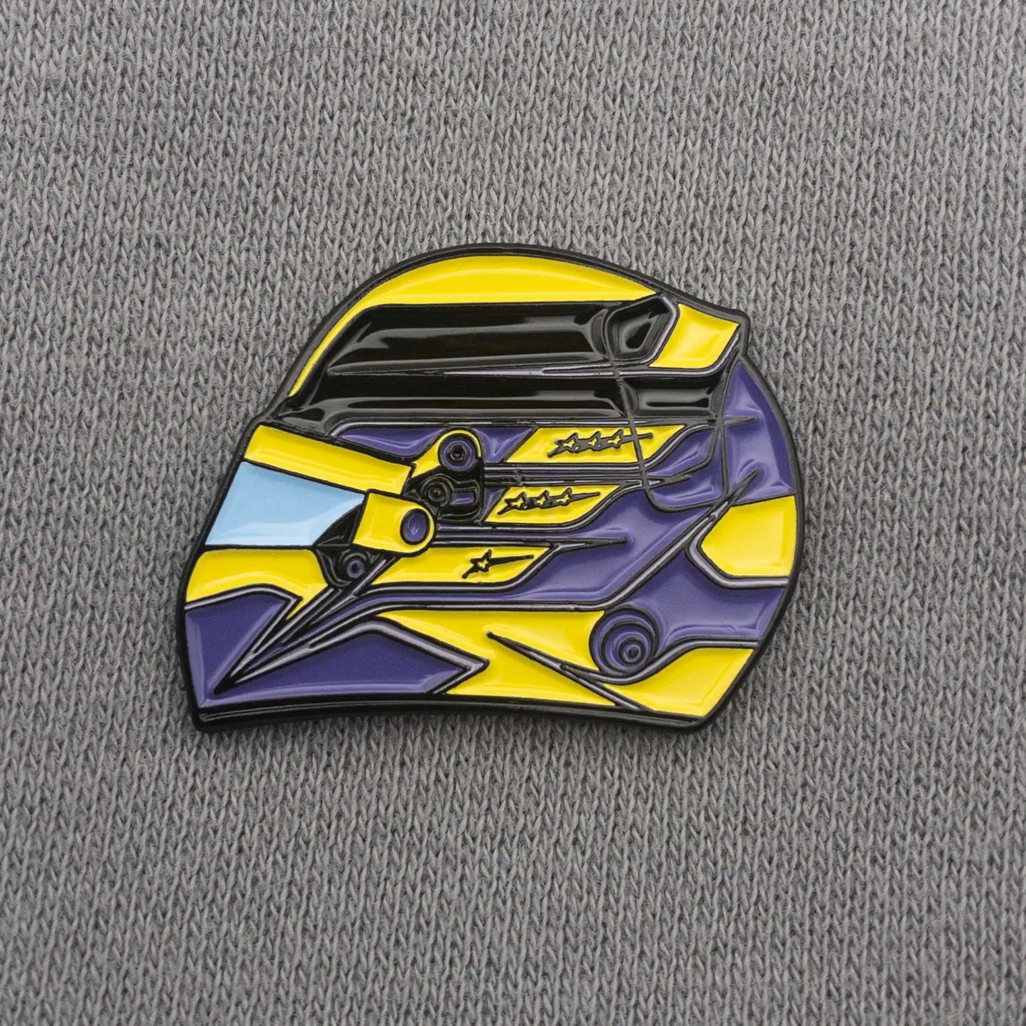 Lewis Hamilton 2023 Helmet Enamel Pin shown on cloths