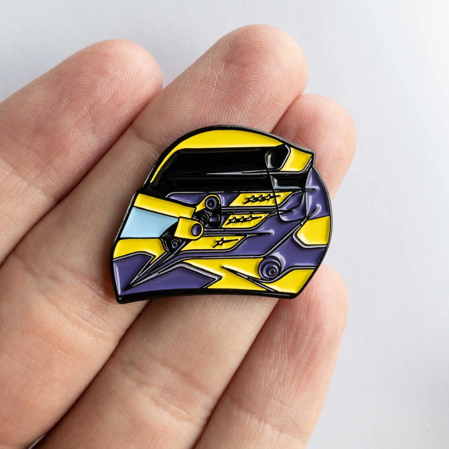 Lewis Hamilton 2023 Helmet Enamel Pin shown on hand