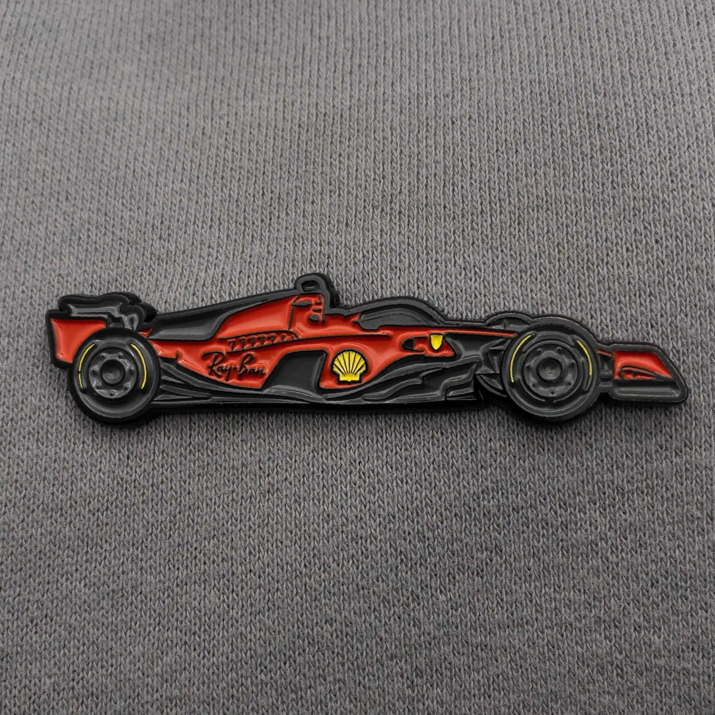 Ferrari SF-23 Formula One Car Enamel Pin shown on clothes