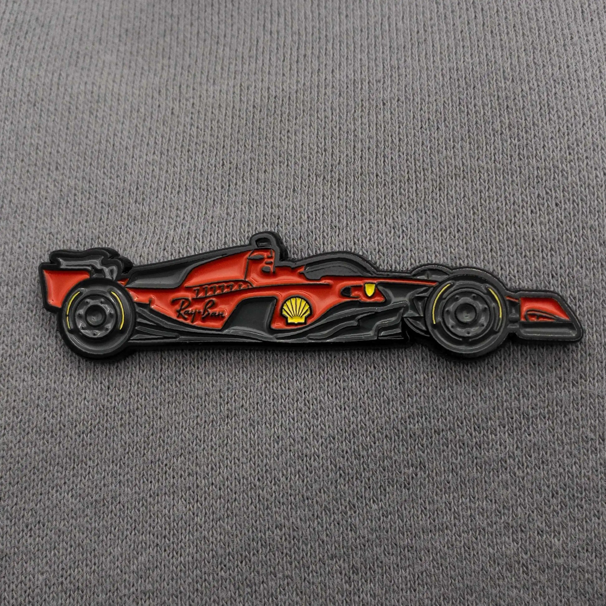 Ferrari SF-23 Formula One Car Enamel Pin shown on clothes