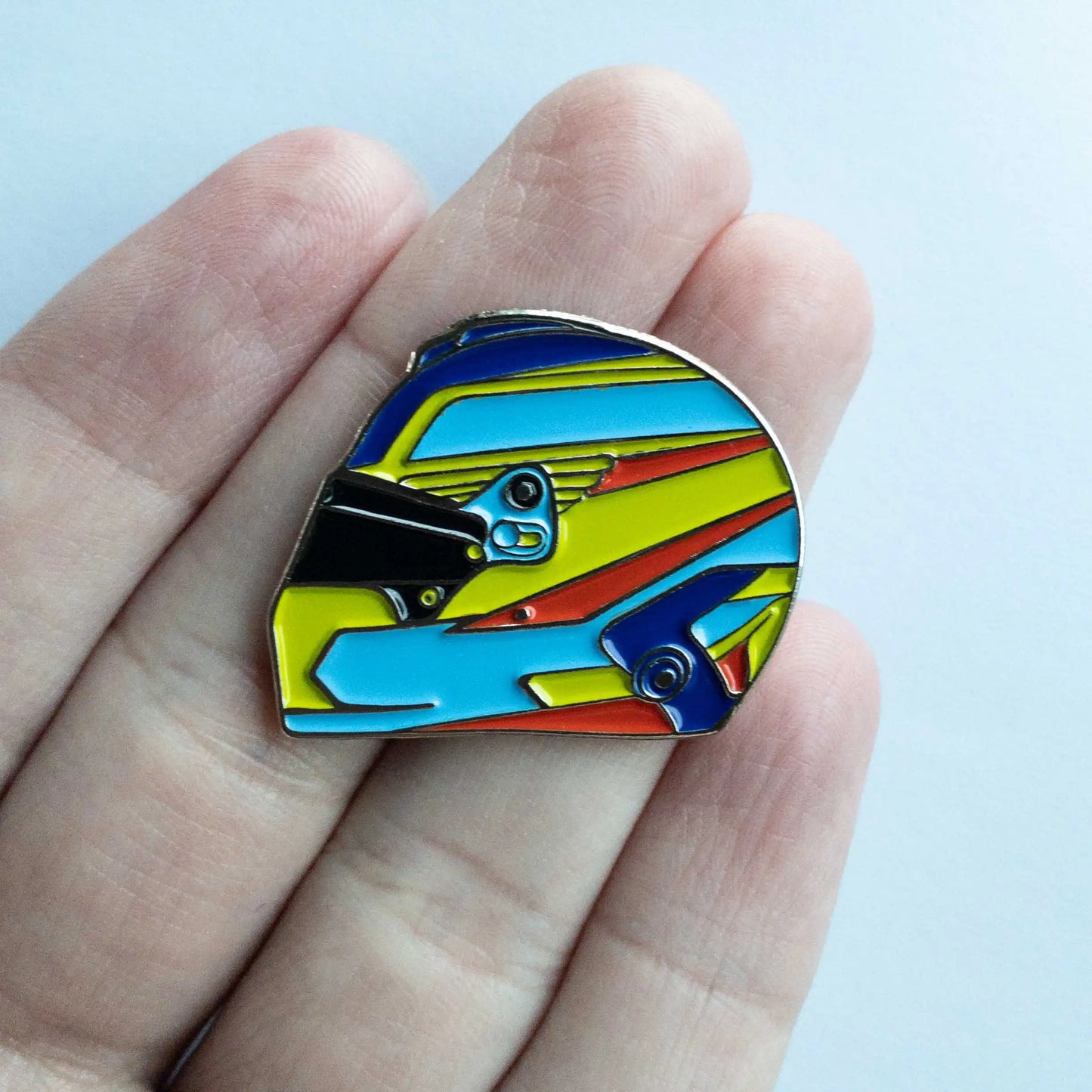 Fernando Alonso 2023 Helmet Pin shown on hand