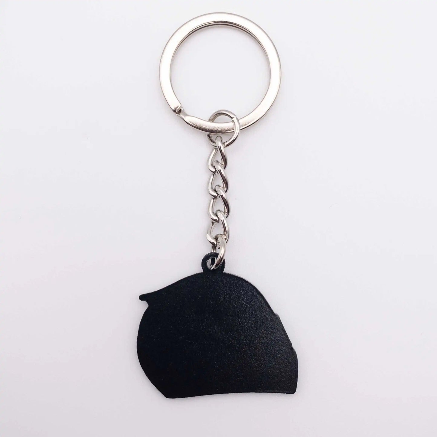 Back of Charles Leclerc 2023 Helmet Enamel Keychain shown on white background