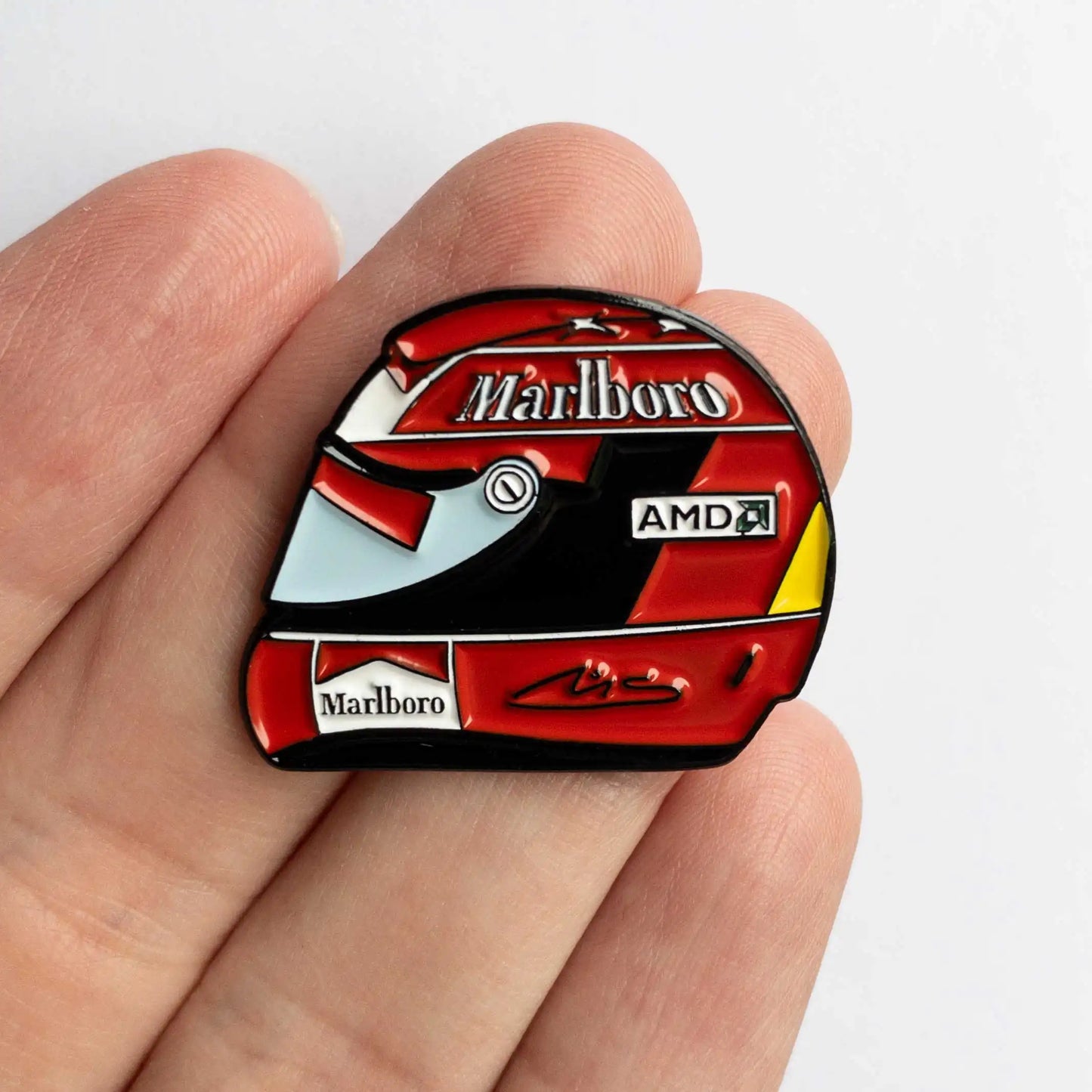 Michael Schumacher 2004 Helmet Enamel Pin shown on hand