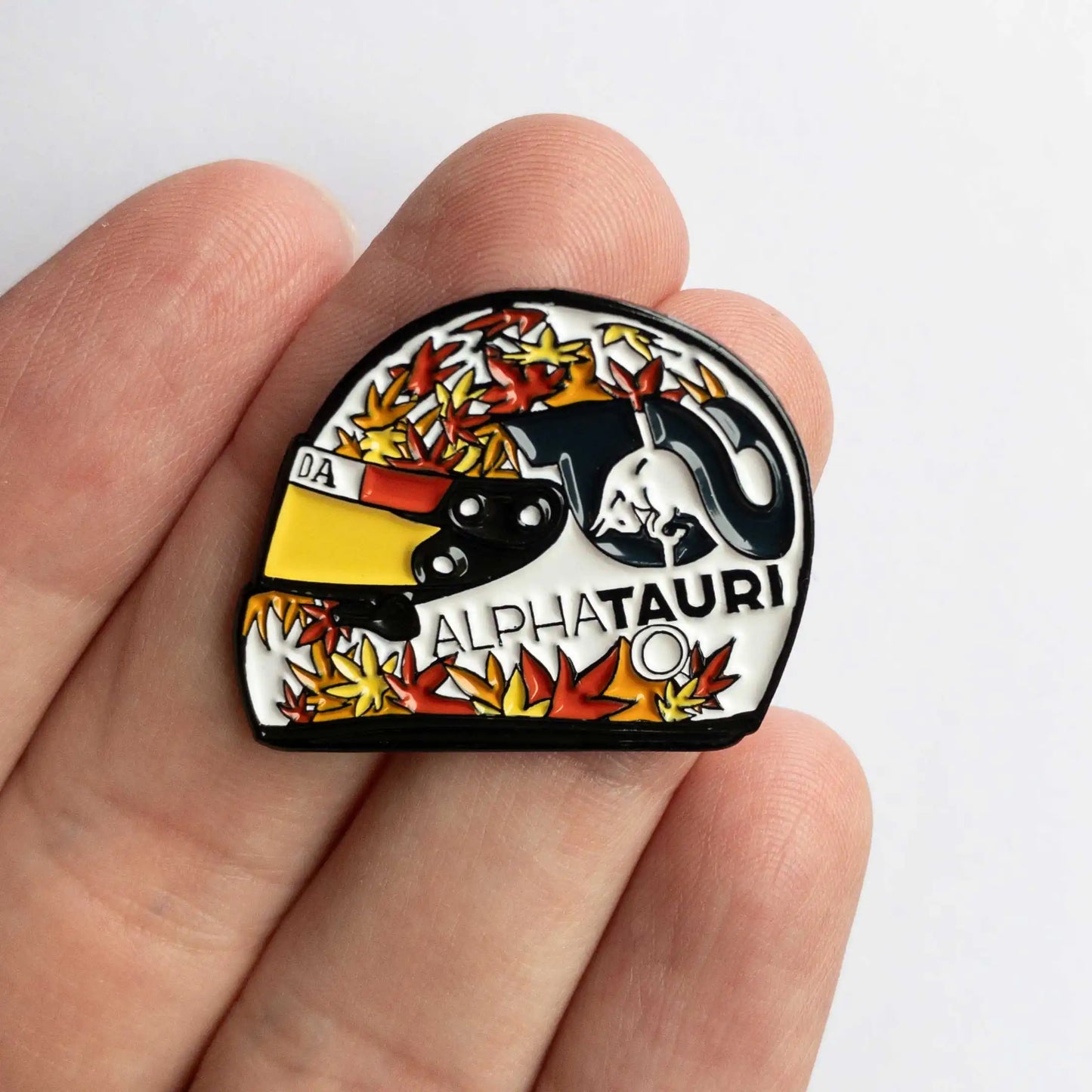 Yuki Tsunoda 2023 Helmet Enamel Pin shown on hand