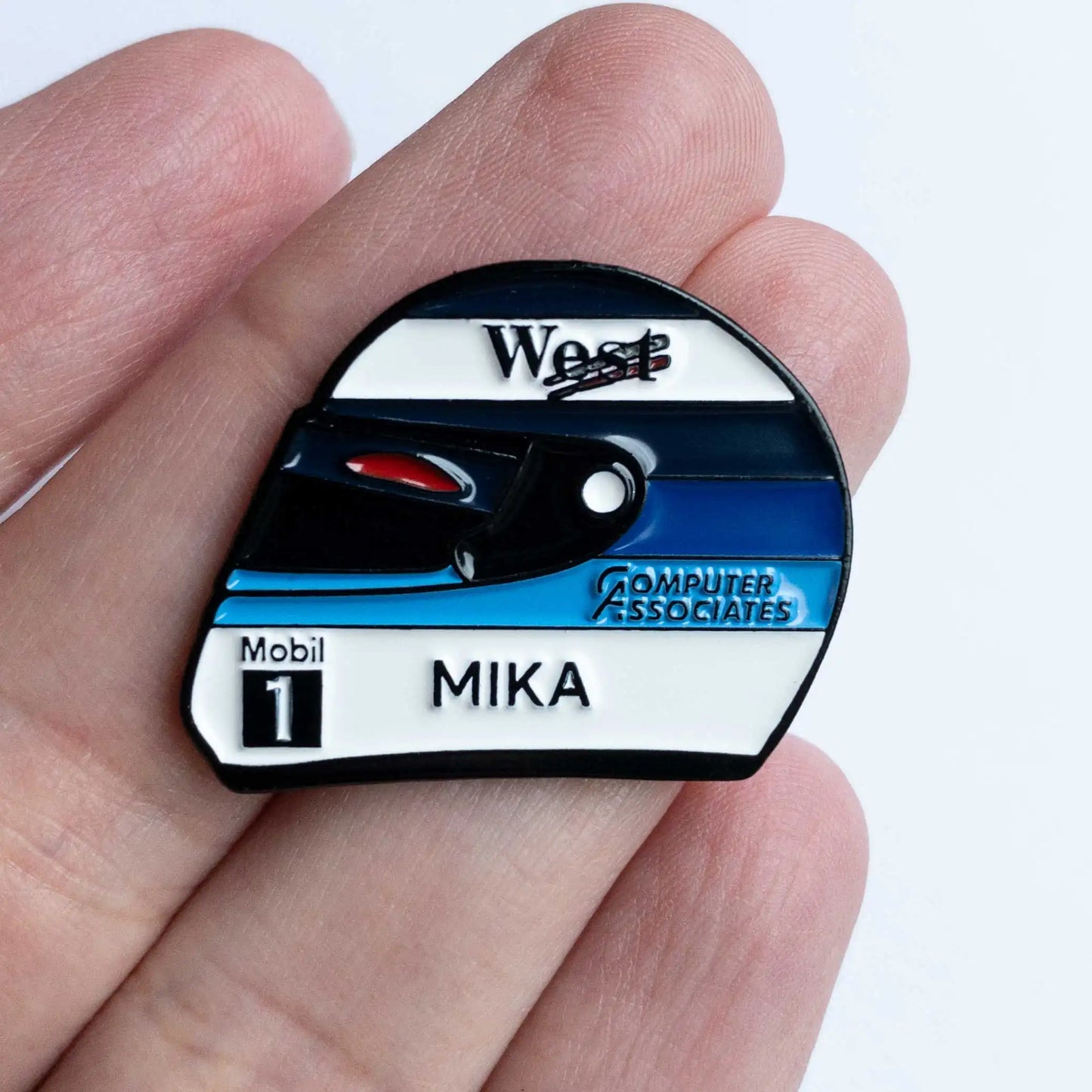 Mika Hakkinen 1998 Helmet Enamel Pin shown on hand