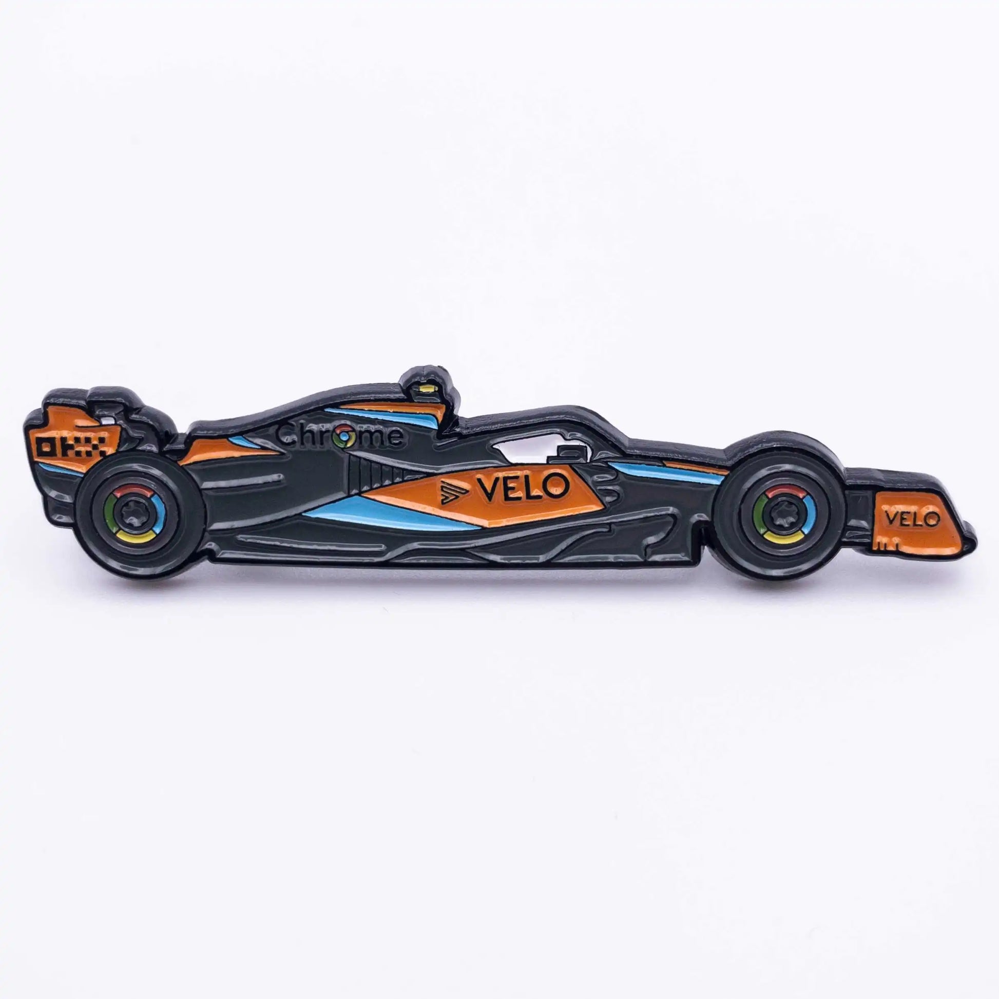 McLaren MCL60 Formula One Car Enamel Pin shown on white background