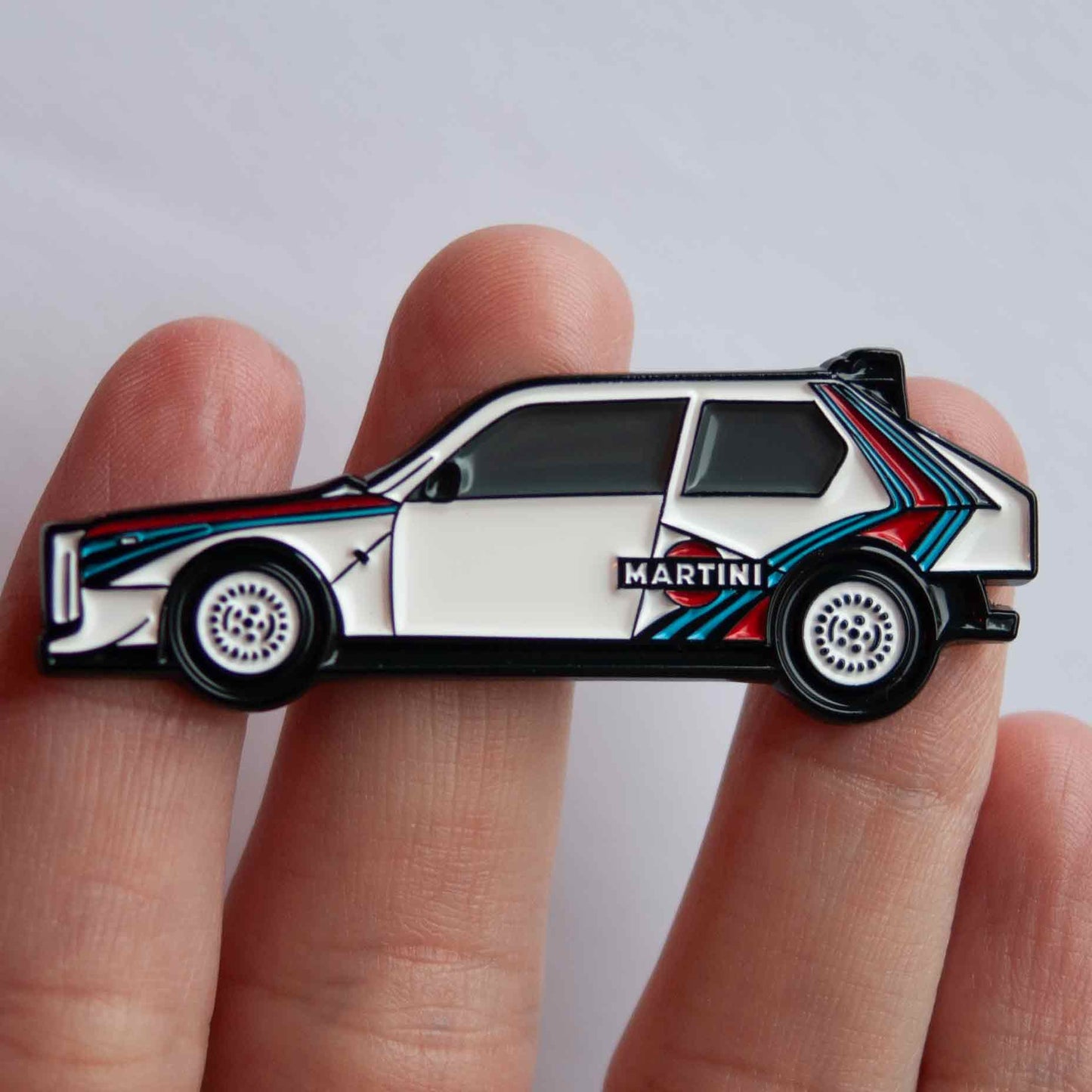 Lancia Delta S4 Rally Car Enamel Pin shown on hand