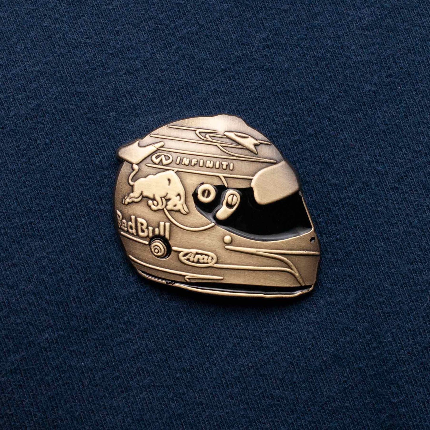 Sebastian Vettel 2014 Monaco Special Edition Helmet Die-Cast Pin shown on blue cloth