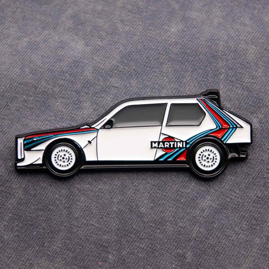 Lancia Delta S4 Rally Car Enamel Pin shown on grey cloth