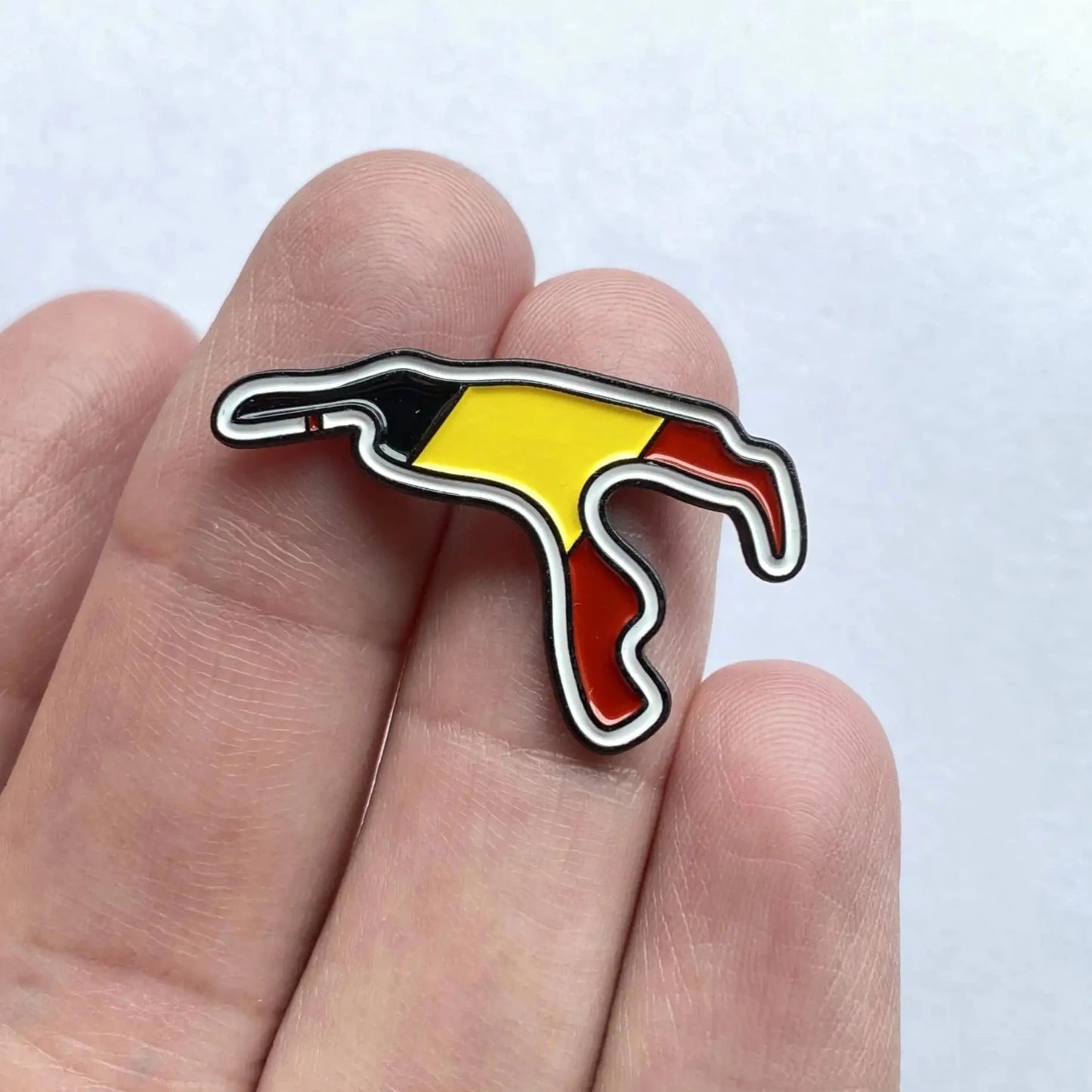 Circuit de Spa-Francorchamps Enamel Pin shown on hand
