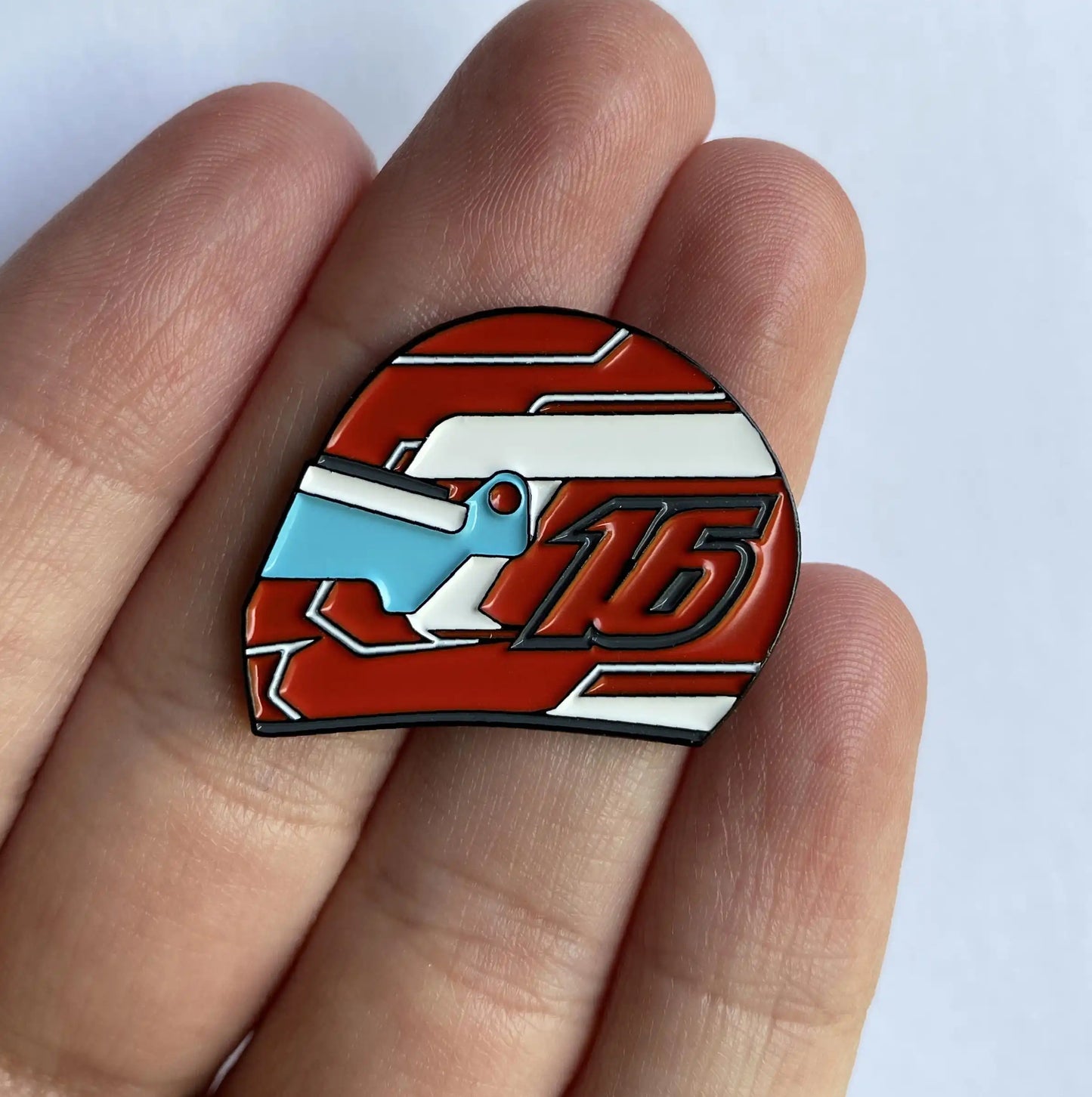 Charles Leclerc 2022 Helmet Enamel Pin shown on hand