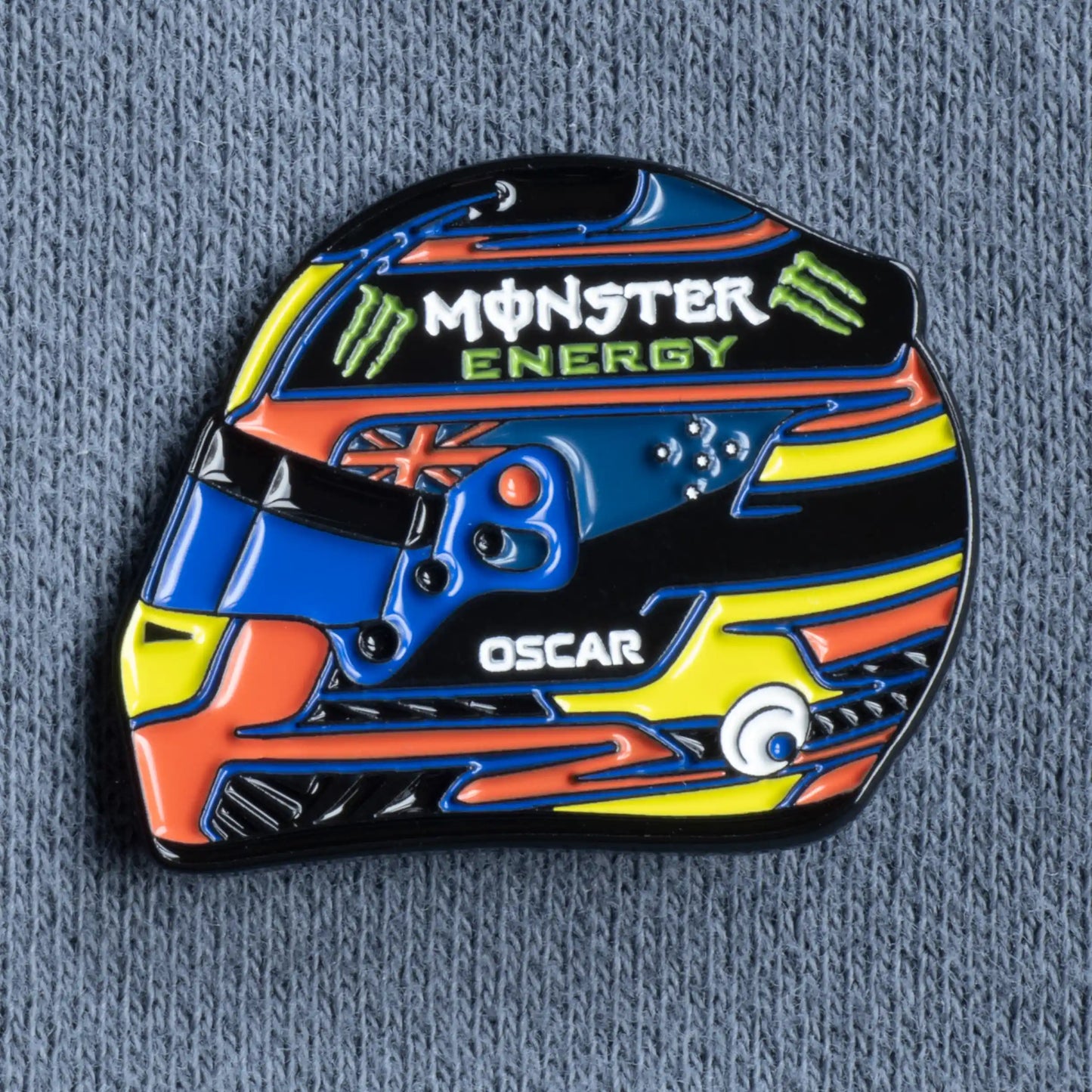 Oscar Piastri 2025 Helmet Enamel Pin on grey clothes