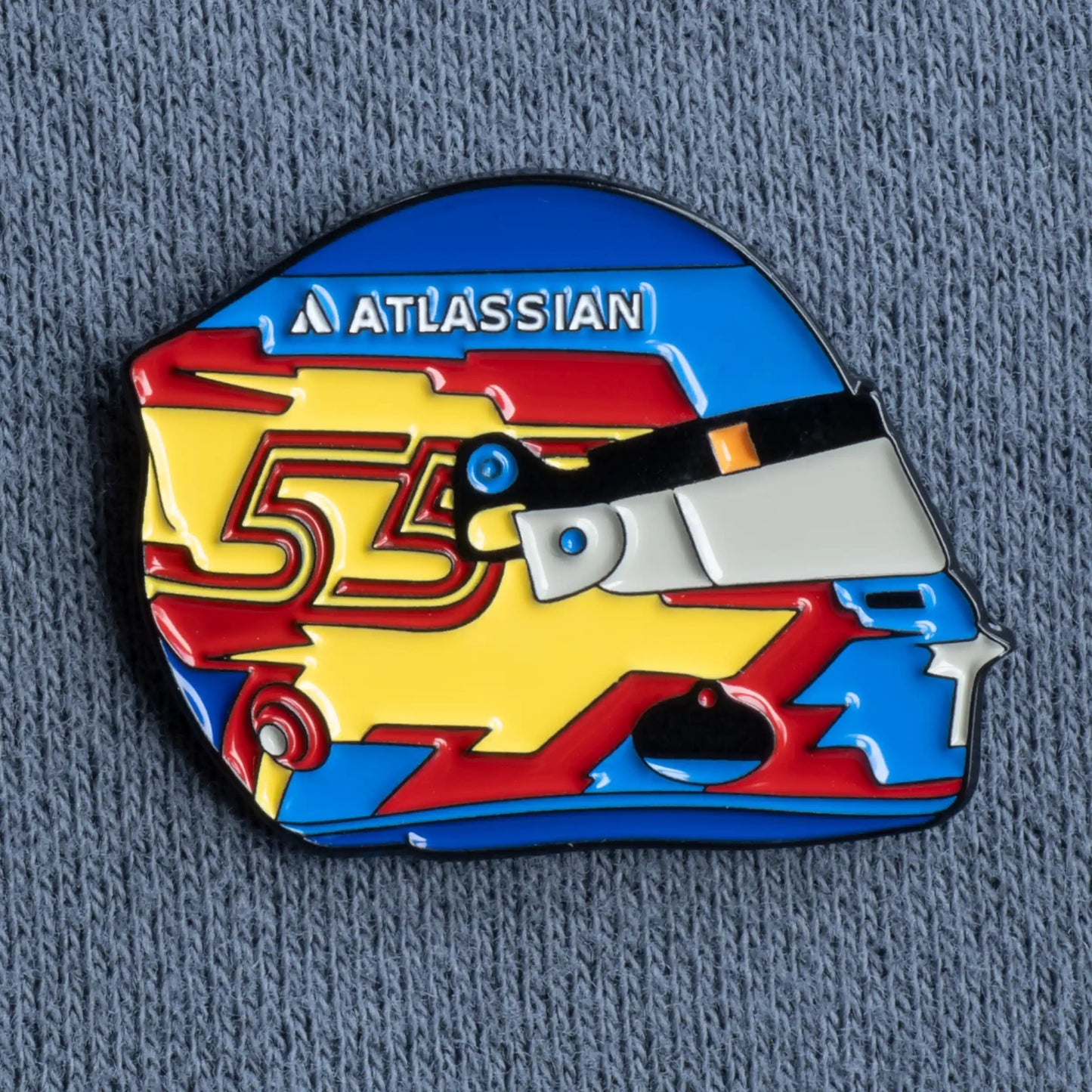 Carlos Sainz 2025 Helmet Enamel Pin shown on grey clothes
