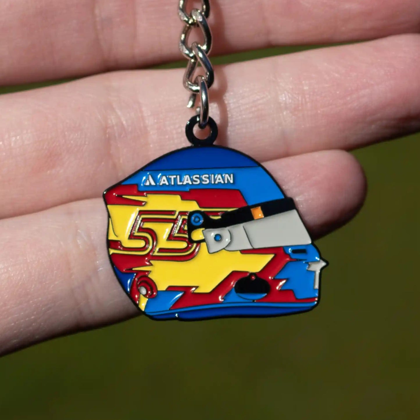 Carlos Sainz 2025 Helmet Enamel Keychain shown on hand