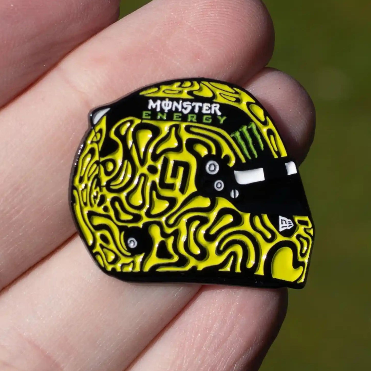 Lando Norris 2025 Helmet Enamel Pin shown on hand