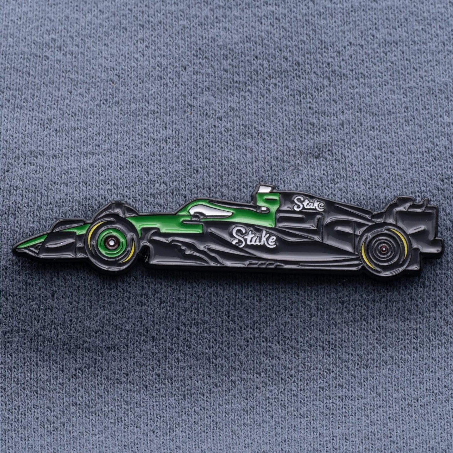 Kick Sauber C45 Formula One Car Enamel Pin shown on grey cloth