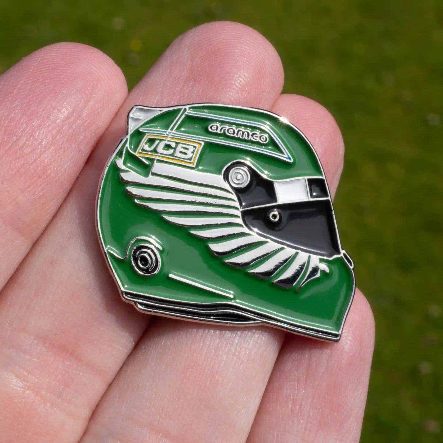 Lance Stroll 2023 Helmet Enamel Pin shown on hand