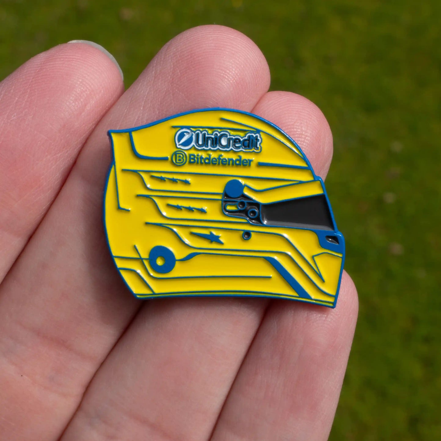 Lewis Hamilton 2025 Miami Helmet Enamel Pin shown on hand