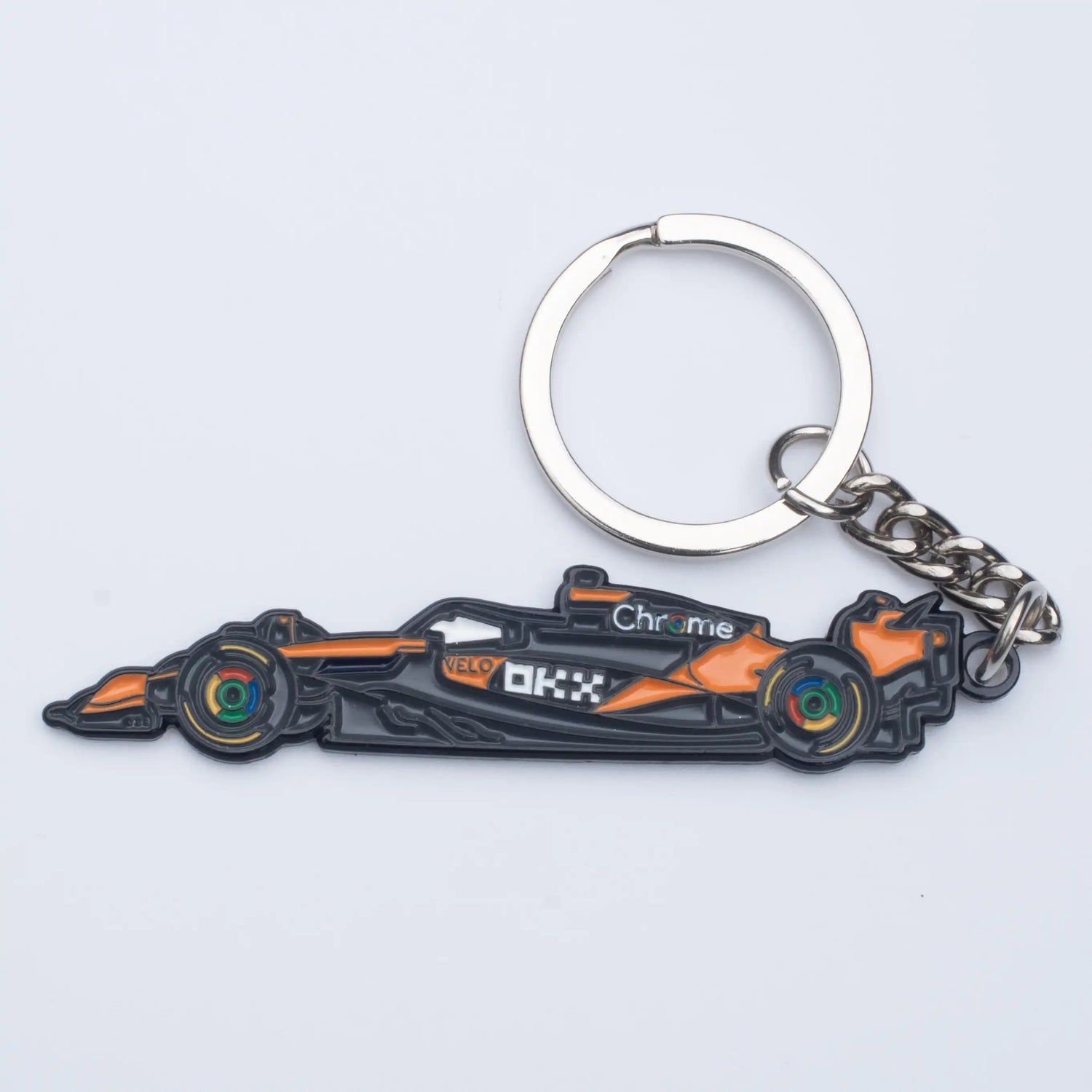 McLaren MCL39 Formula One Car Enamel Keychain shown on white background
