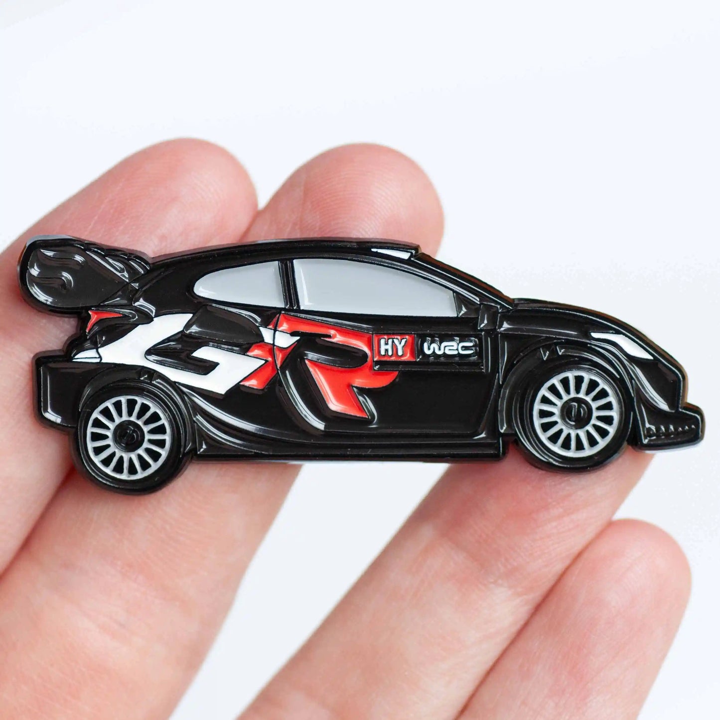 Toyota GR Yaris 2024 Rally1 Car Enamel Pin shown on hand