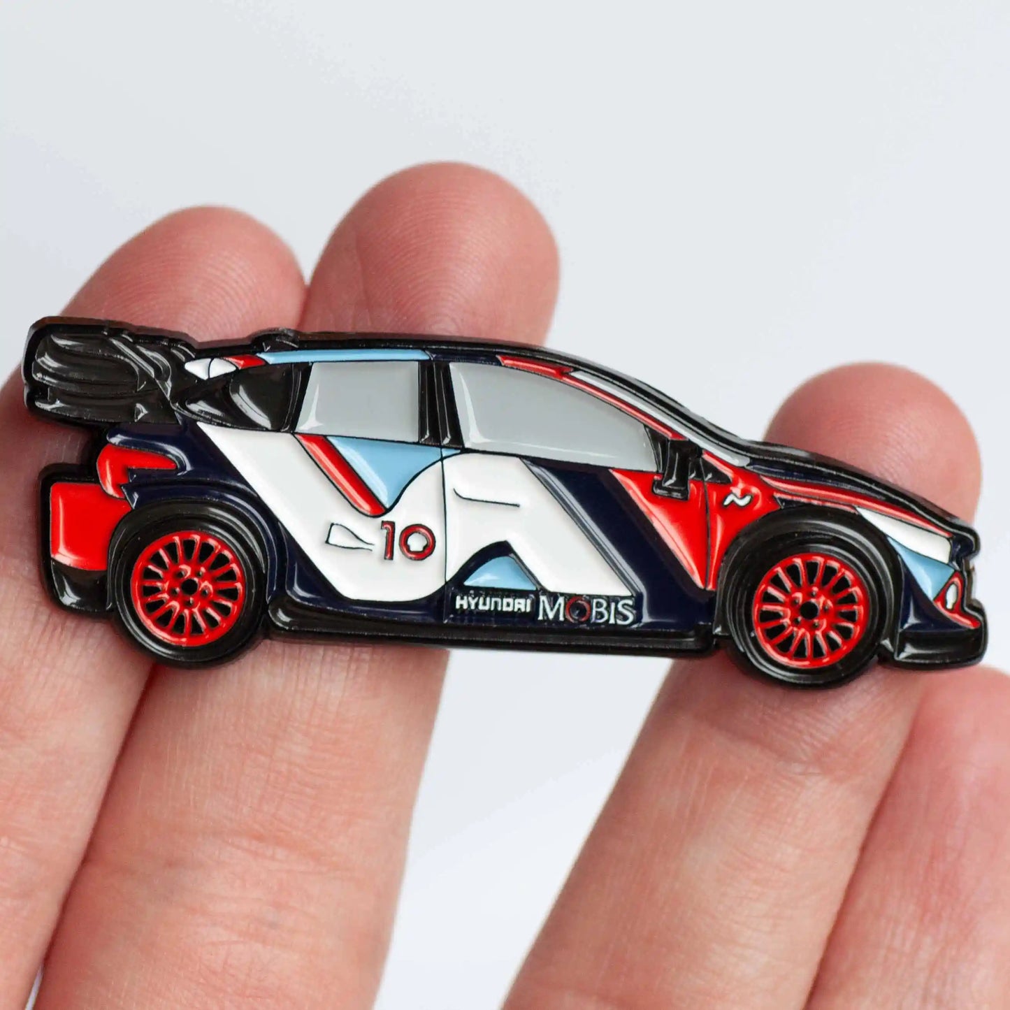 Hyundai i20 N 2024 Rally1 Car Enamel Pin shown on hand