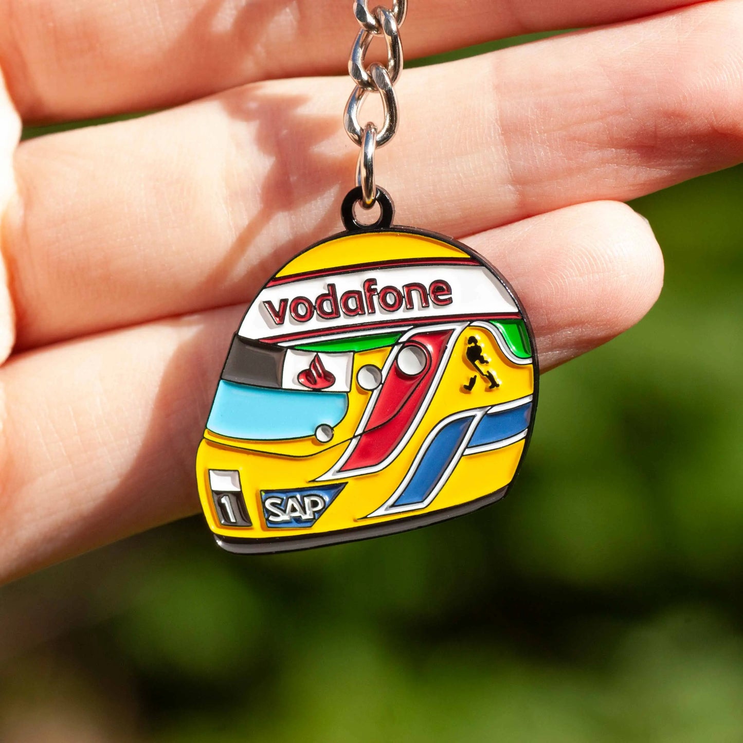 Lewis Hamilton 2008 Helmet Enamel Keychain shown on hand