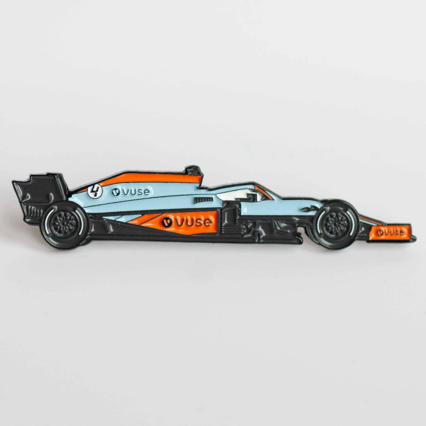 McLaren MCL35M Gulf Livery Formula One Car Enamel Pin shown on white background