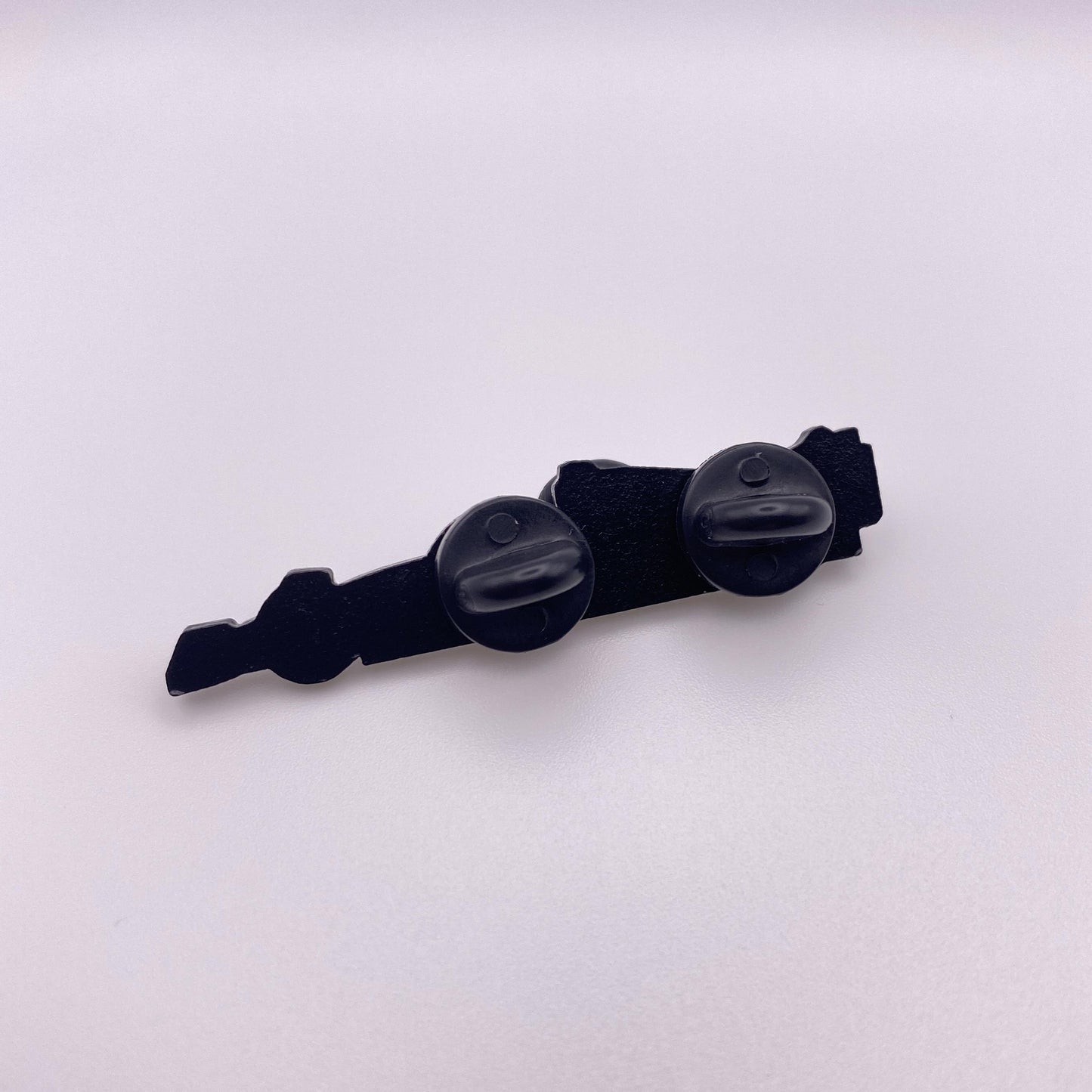Back of Red Bull RB18 Formula One Enamel Pin, black dye plating with two black rubber clutches