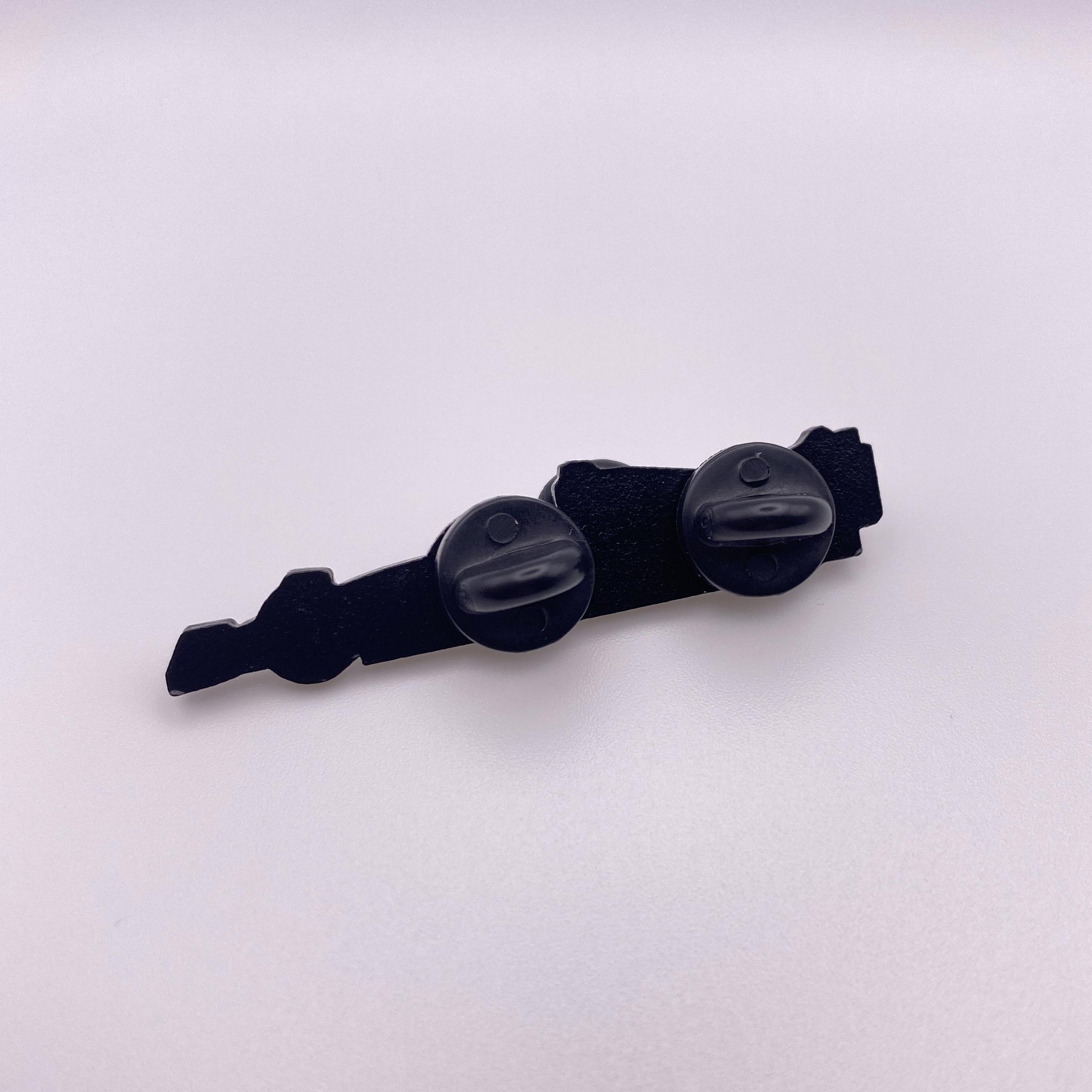 Back of Red Bull RB18 Formula One Enamel Pin, black dye plating with two black rubber clutches
