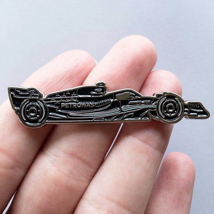 Mercedes W14 Formula One Car Enamel Pin shown on hand