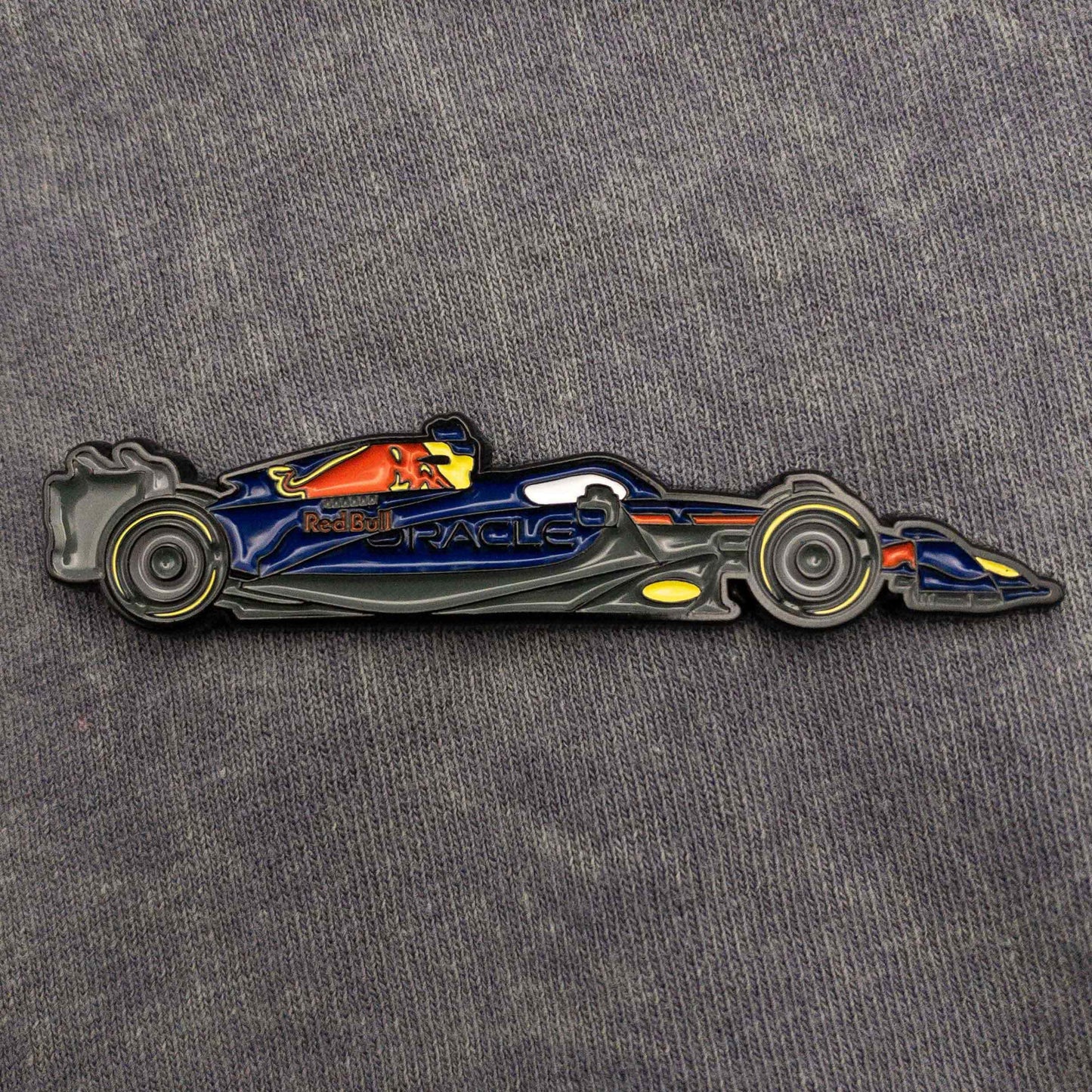 Red Bull RB19 Formula One Car Enamel Pin shown on clothes