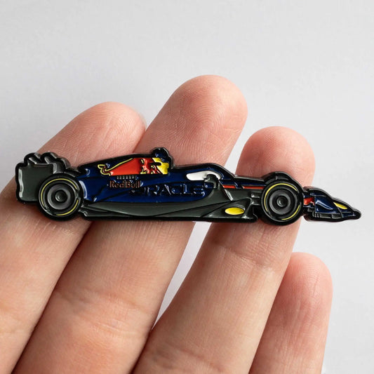 Red Bull RB19 Formula One Car Enamel Pin shown on hand