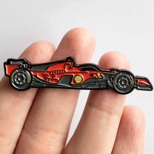 Ferrari SF-23 Formula One Car Enamel Pin shown on hand