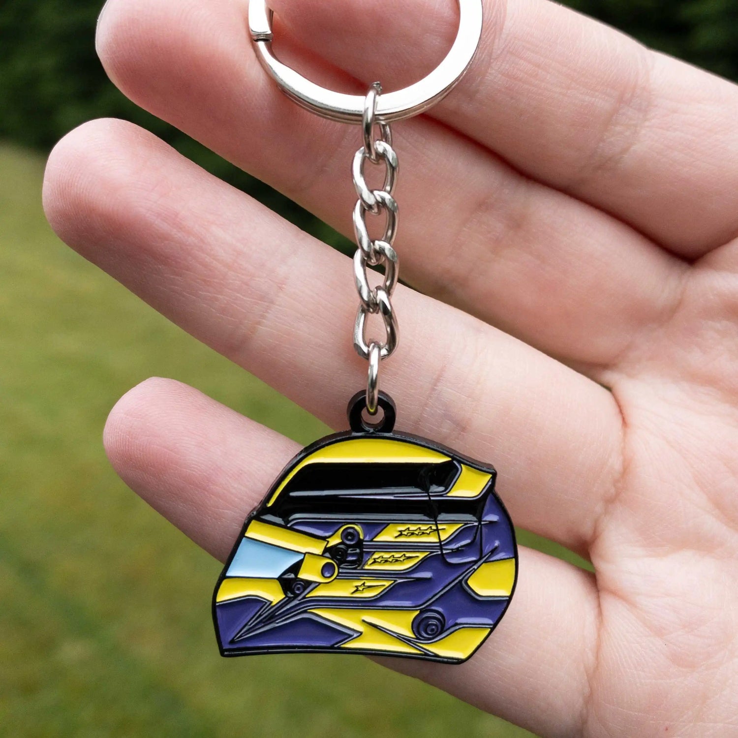 Lewis Hamilton 2023 Helmet Enamel Keychain shown on hand