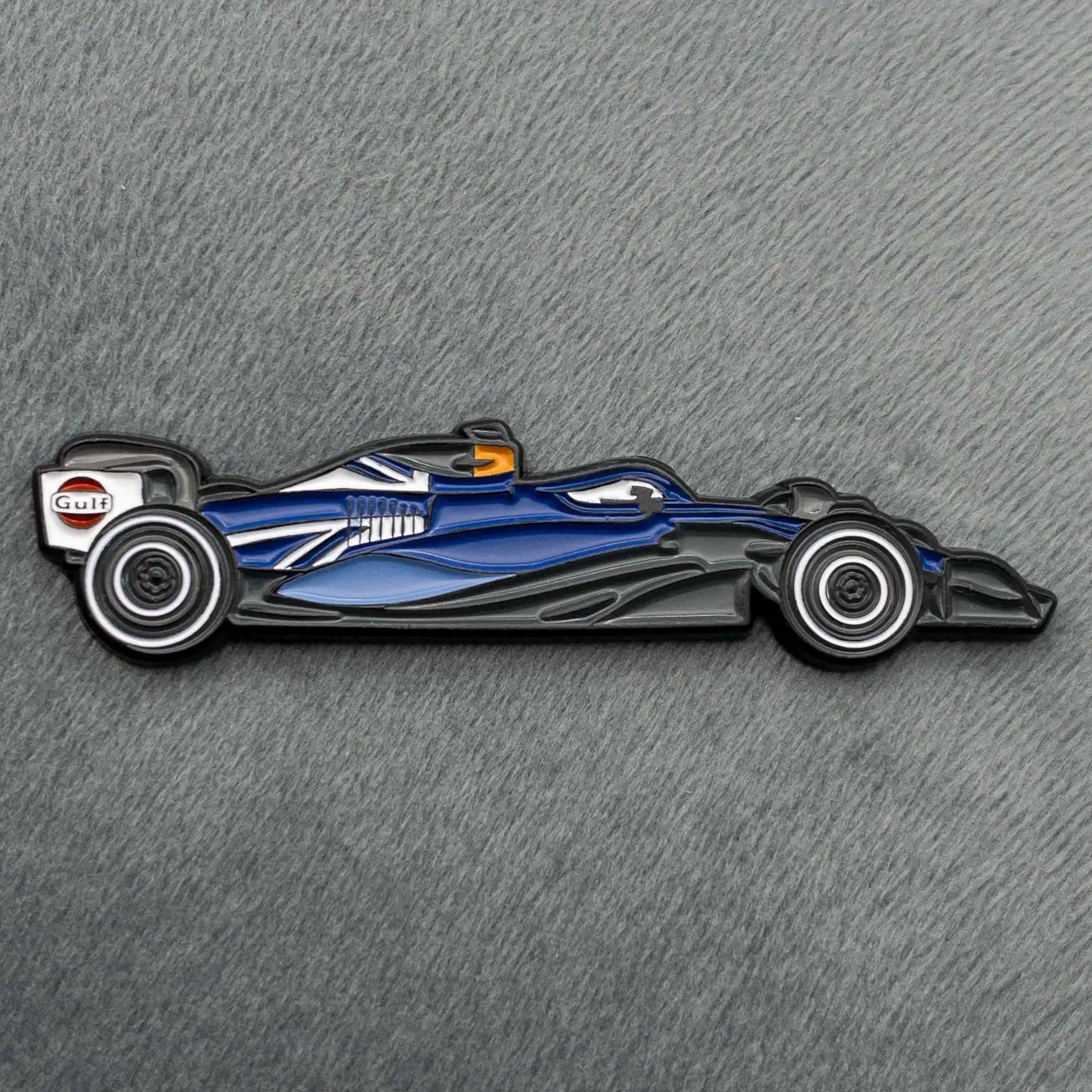 Williams FW45 800th GP Special Livery Enamel Pin shown on grey cloth