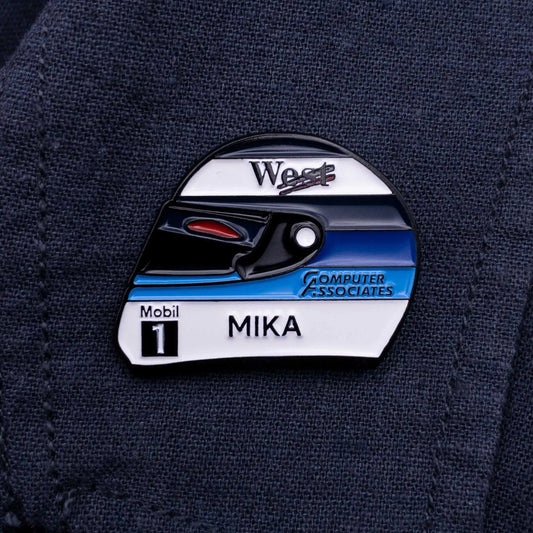 Mika Hakkinen 1998 Helmet Enamel Pin shown on dark blue clothes