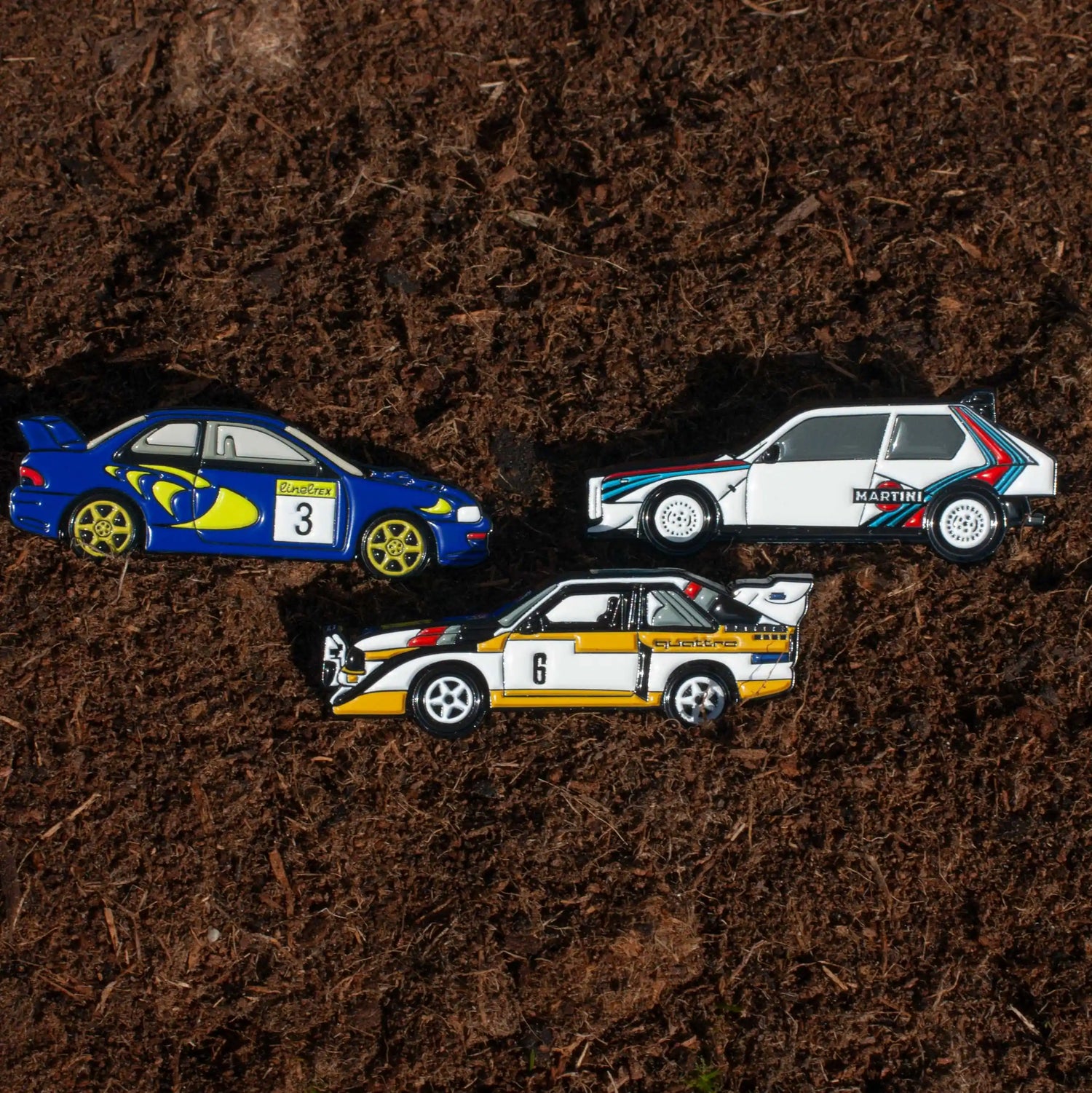 Rally Car Pin Bundle shown on dirt background