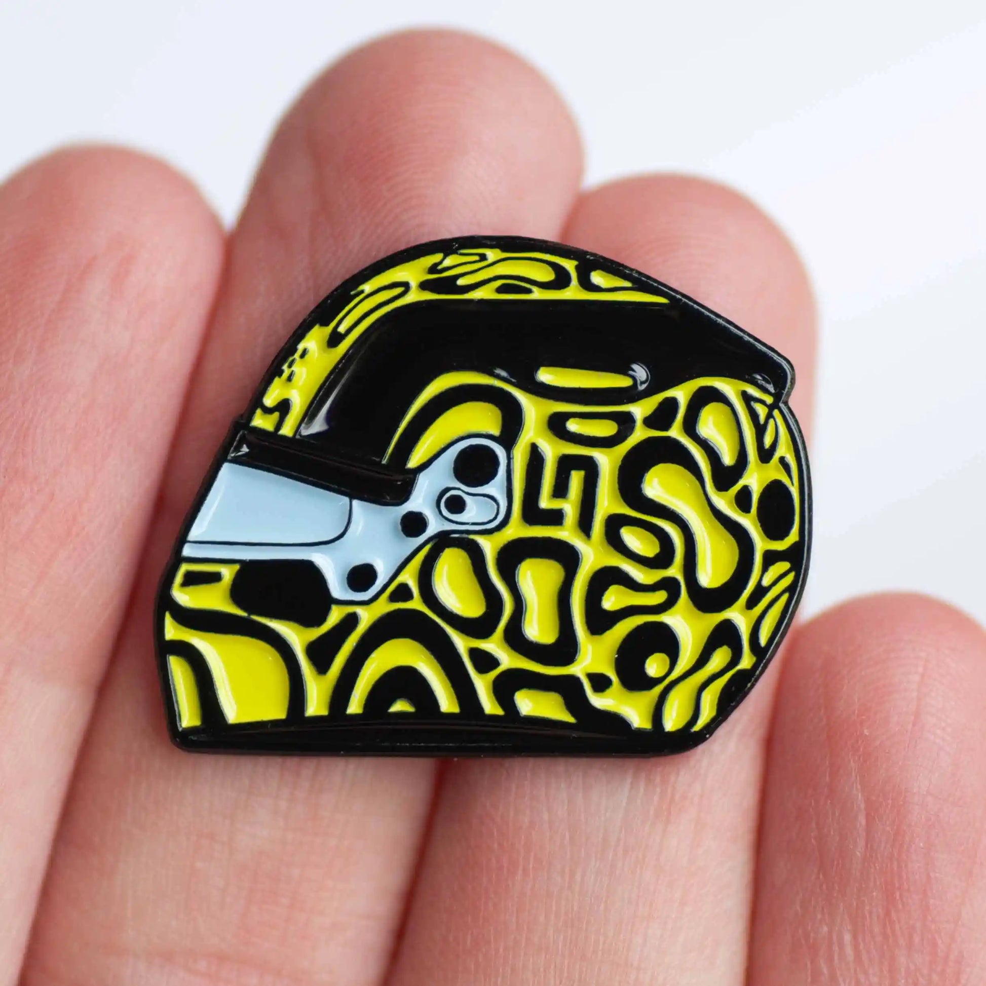 Lando Norris 2024 Helmet Enamel Pin Badge shown on hand