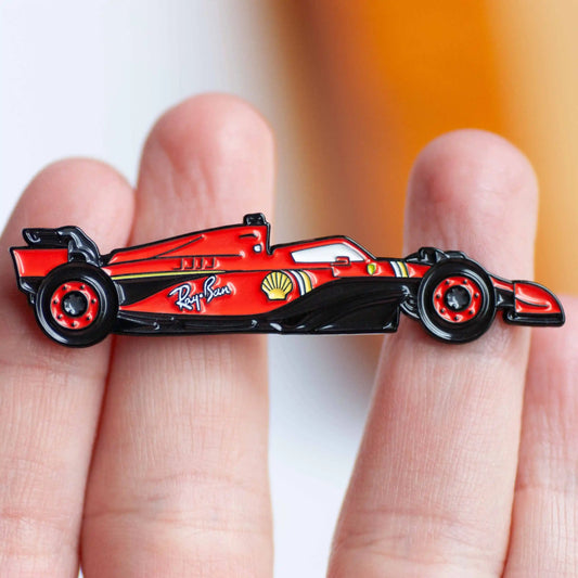 Ferrari SF-24 Formula One Car Enamel Pin Badge shown on hand