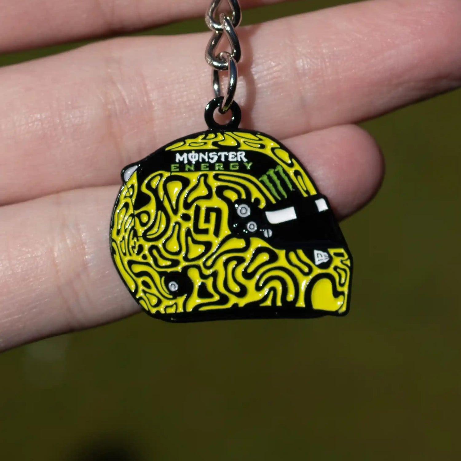 Lando Norris 2025 Helmet Enamel Keychain shown on hand