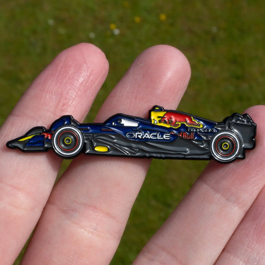 Red Bull RB21 Formula One Car Enamel Pin shown on hand