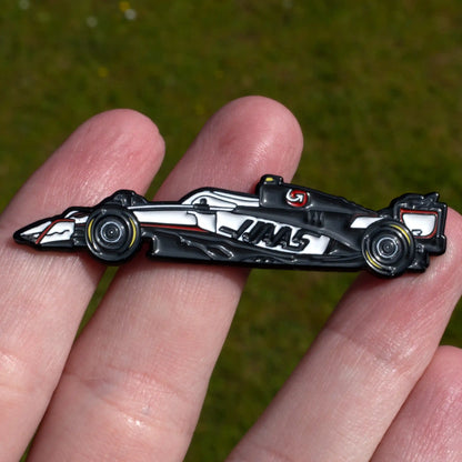 Haas VF-25 Formula One Car Enamel Pin shown on hand