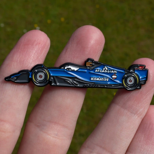 Williams FW47 Formula One Car Enamel Pin shown on hand
