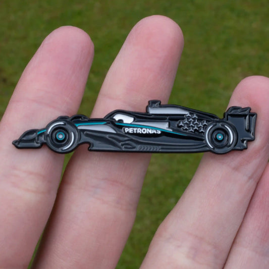 Mercedes W16 Formula One Car Enamel Pin shown on hand
