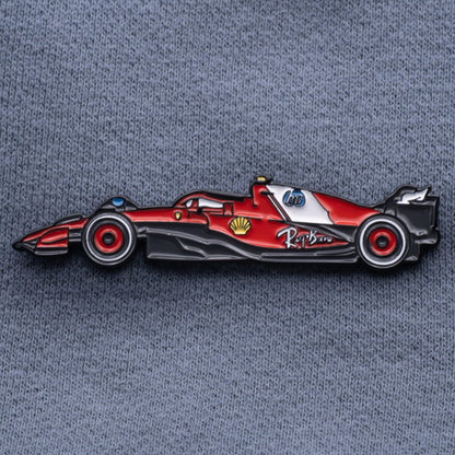 Ferrari SF-25 Formula One Car Enamel Pin shown on grey cloth