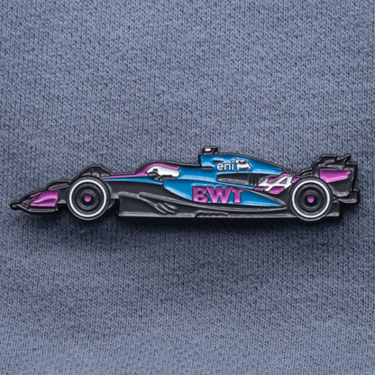 Alpine A525 Formula One Car Enamel Pin shown on grey cloth